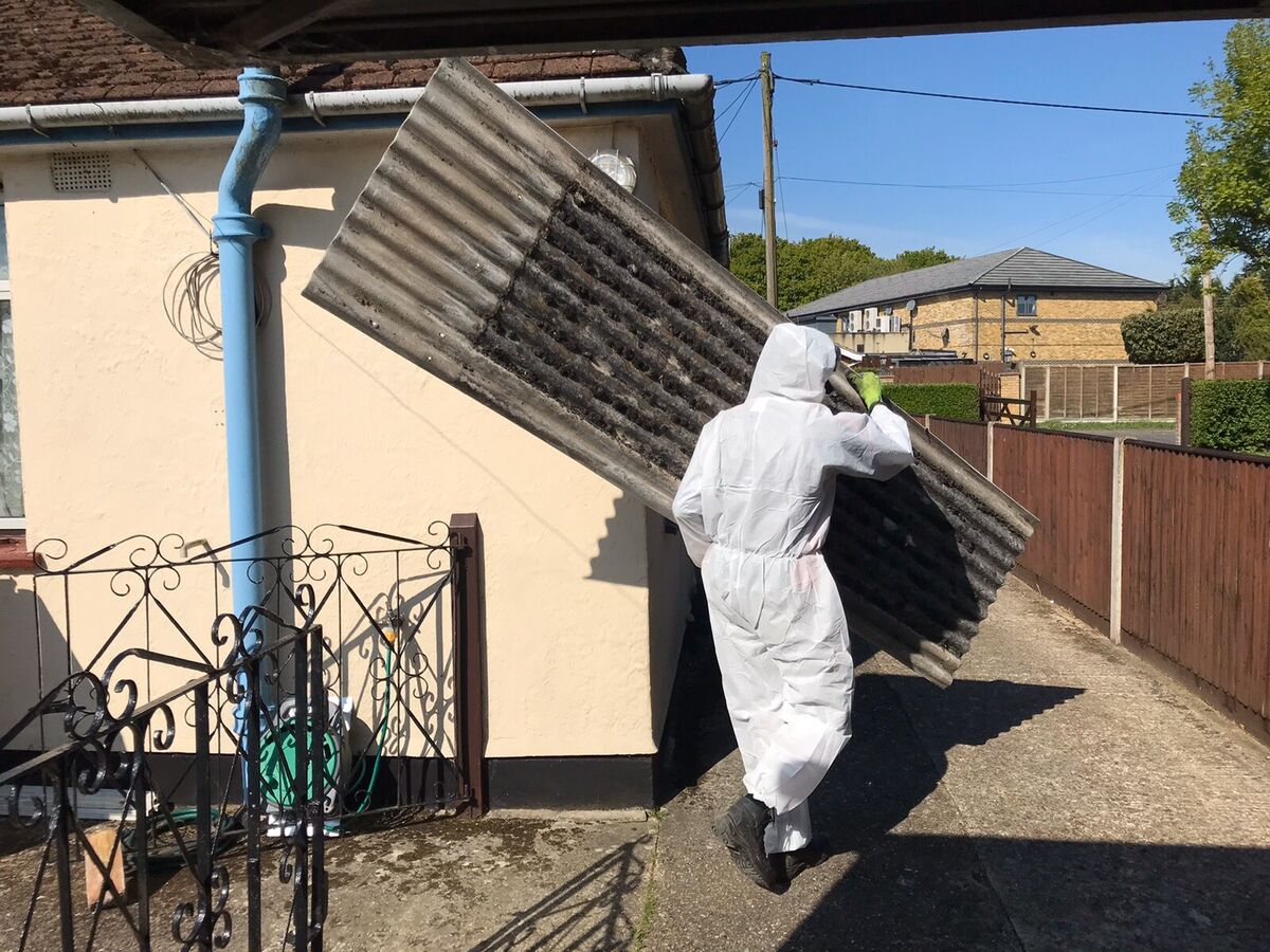 Asbestos disposal operatives collecting sealed waste in Caterham - CR3